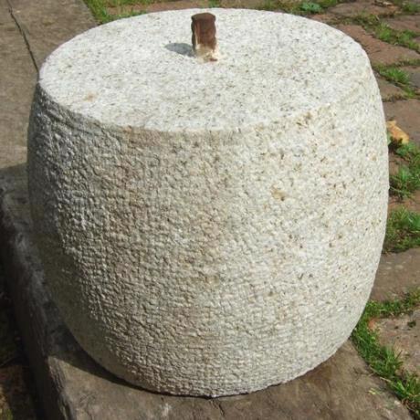 Granite, drum round, staddle stone with iron pin