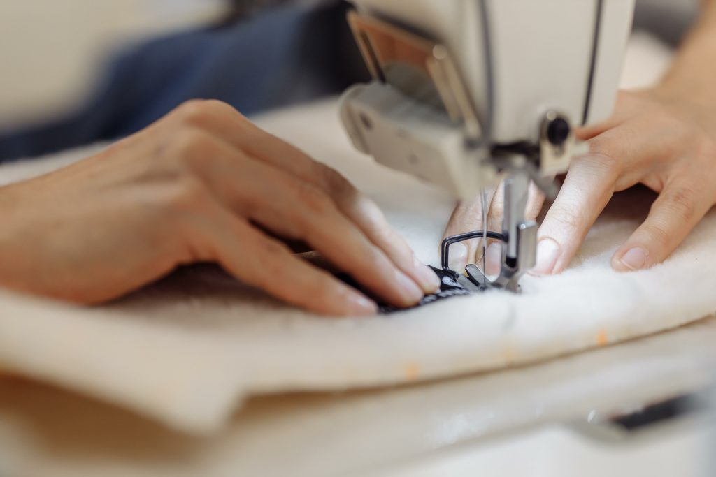 sewing machine scribbling fabric. tailoring at the factory.