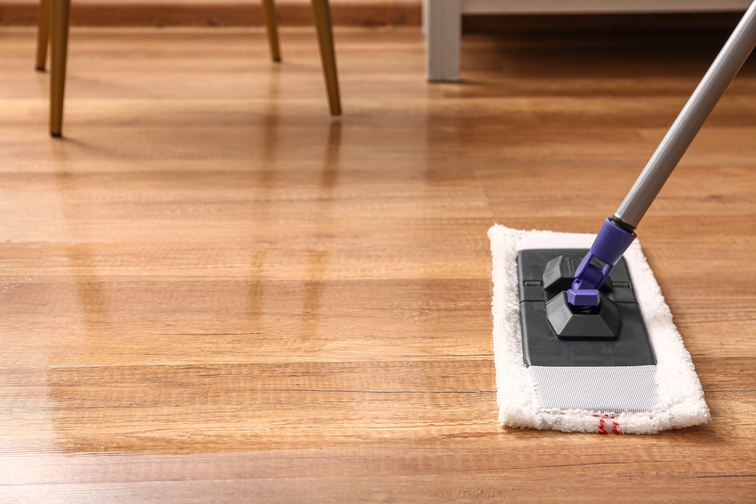 Timber Flooring Guide – Choosing the Right Floor for Your Home 7 Cleaning of wooden laminate floor with mop, closeup