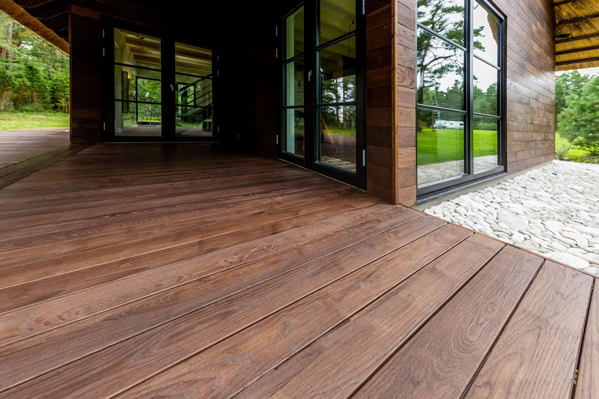 The Round Wood Materials Guide 5 Thermory Benchmark thermo ash cladding C20 decking D45J. Private house in Saaremaa Estonia
